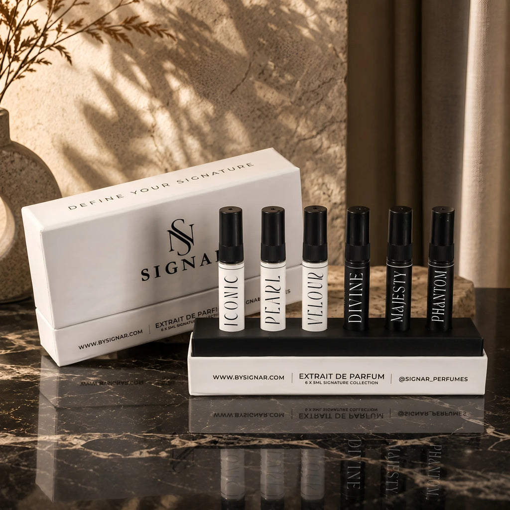SIGNAR Discovery Set featuring six 5ml perfume tester vials standing upright in a black tray on dark marble.