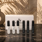 SIGNAR luxury Discovery Set box with six 5ml perfume sample vials aligned on dark marble countertop.
