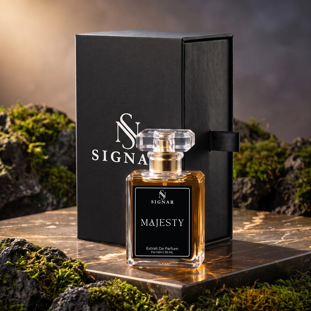 SIGNAR Majesty Eau De Parfum bottle with amber liquid and clear cap, displayed in front of a black SIGNAR box on a stone slab surrounded by moss and rocks.