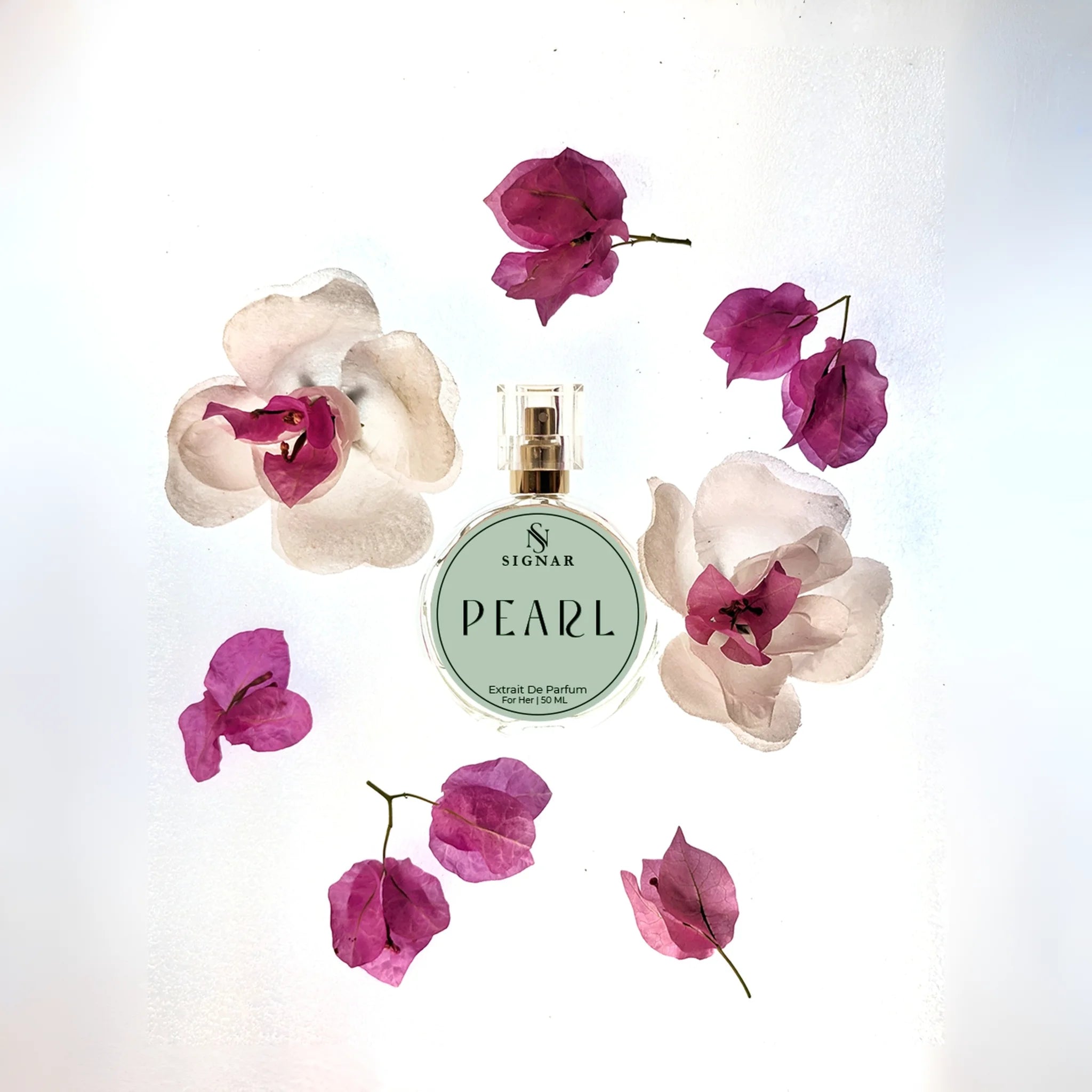 A round glass perfume bottle labeled 'SIGNAR PEARL' with a gold cap, arranged on a white background with decorative pink and white flowers around it.