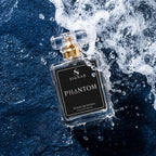 A clear glass perfume bottle labeled 'SIGNAR PHANTOM' with a gold spray top, floating in dramatic water spray against a dark blue textured background.