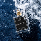 A clear glass perfume bottle labeled 'SIGNAR PHANTOM' with a gold spray top, floating in dramatic water spray against a dark blue textured background.